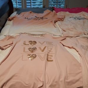 brand name tops and two swimming sets